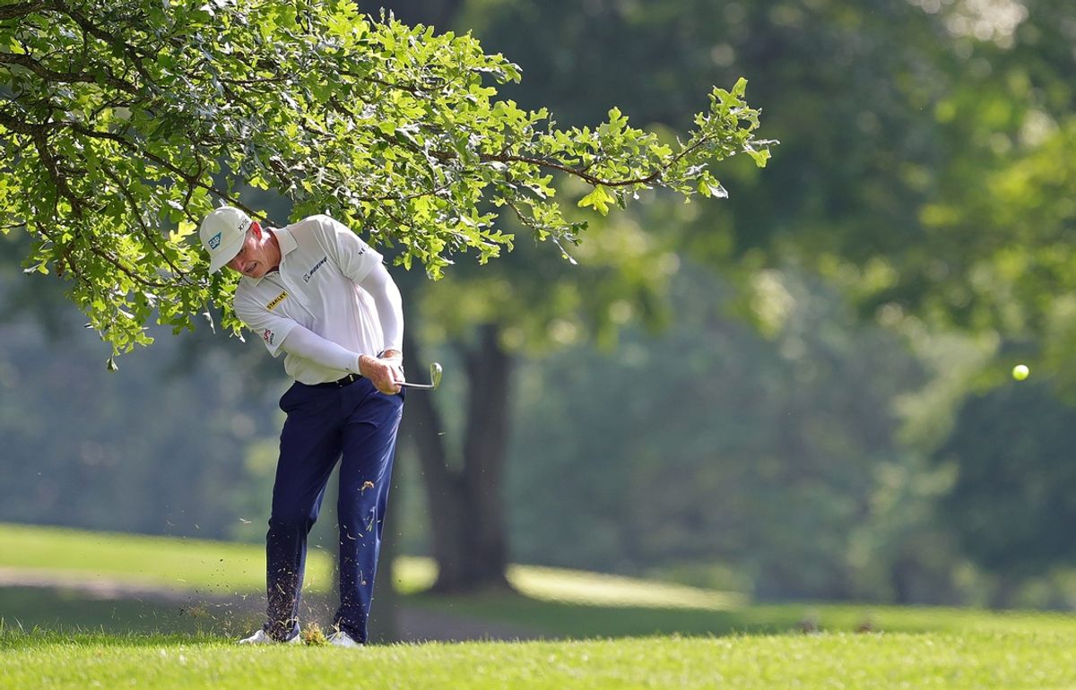 Ernie Els plays his second shot from the rough on the 18th hole during the second round of the Kaulig Companies Championship at Firestone Country Club, Friday, July 12, 2024, in Akron, Ohio.