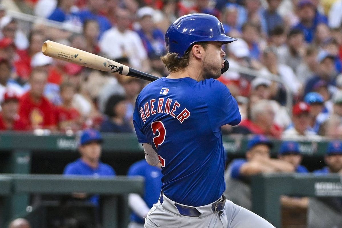 Jul 12, 2024; St. Louis, Missouri, USA;  Chicago Cubs second baseman Nico Hoerner (2) drives in a run as he ground out against the St. Louis Cardinals during the third inning at Busch Stadium. Mandatory Credit: Jeff Curry-USA TODAY Sports