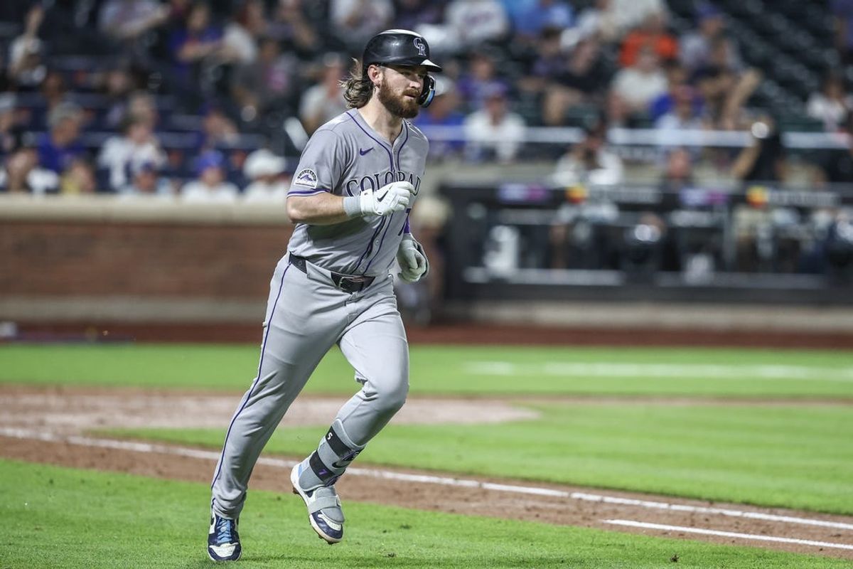 Jul 12, 2024; New York City, New York, USA;  Colorado Rockies second baseman Brendan Rodgers (7) hits a solo home run in the seventh inning against the New York Mets at Citi Field. Mandatory Credit: Wendell Cruz-USA TODAY Sports
