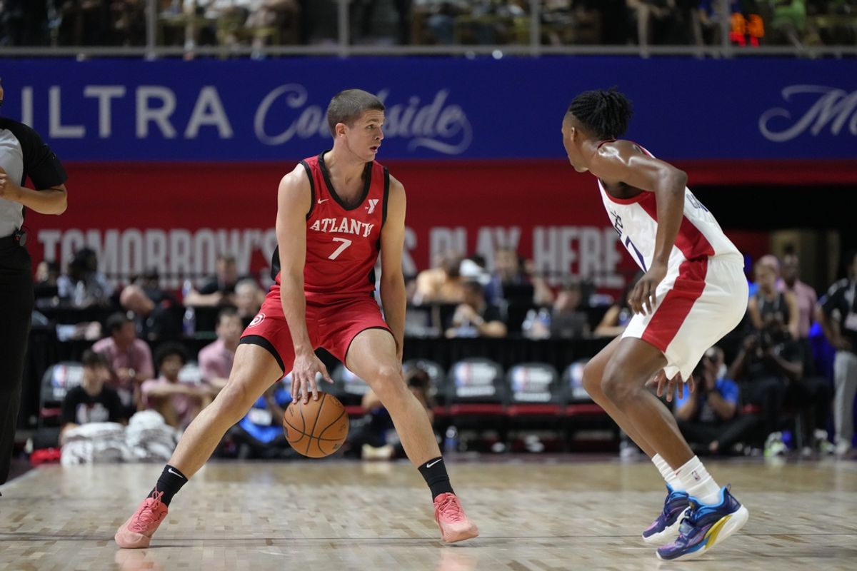 Jul 12, 2024; Las Vegas, NV, USA;  Atlanta Hawks forward/guard Nikola Durisic (7) controls the ball against Washington Wizards guard Bub Carrington (17) during the first half at Thomas & Mack Center. Mandatory Credit: Lucas Peltier-USA TODAY Sports