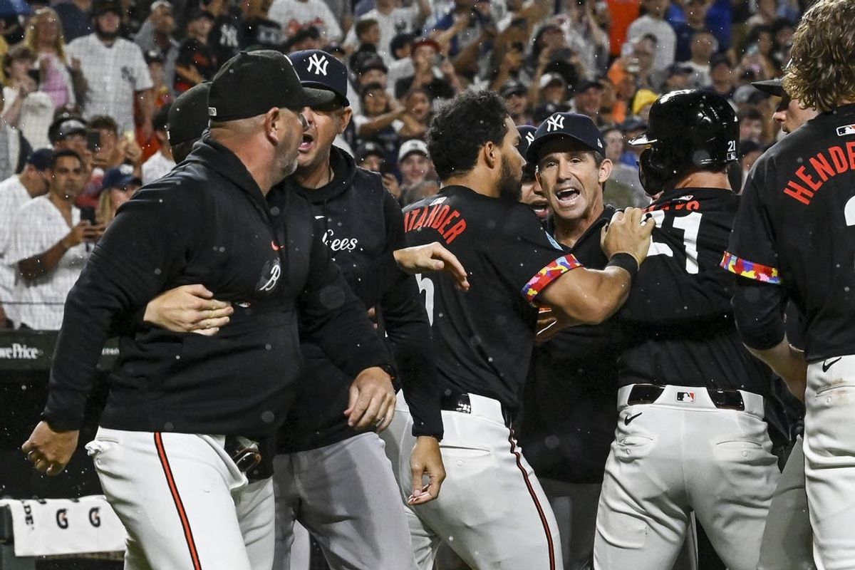Jul 12, 2024; Baltimore, Maryland, USA; New York Yankees bench coach Brad Ausmus (68) and Baltimore Orioles manager Brandon Hyde (18) exchange words during the ninth inning  at Oriole Park at Camden Yards. Mandatory Credit: Tommy Gilligan-USA TODAY Sports