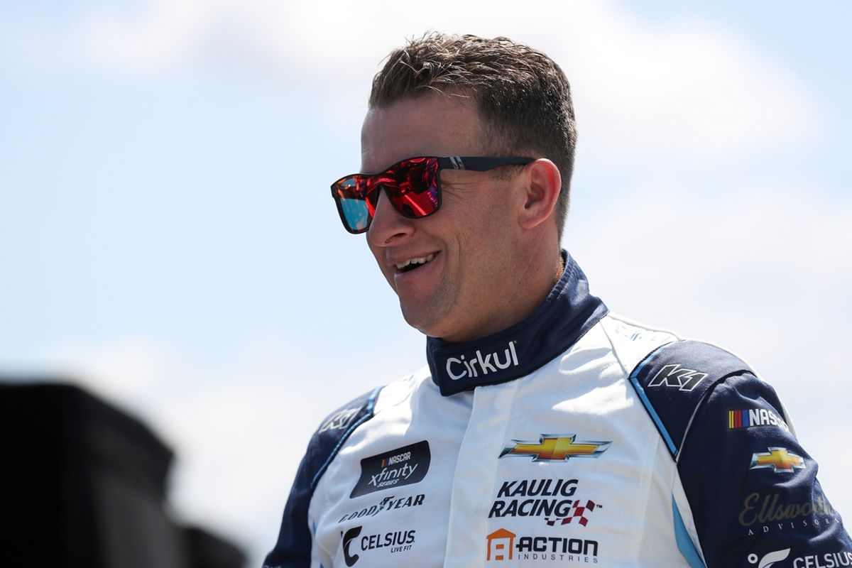 Jul 13, 2024; Long Pond, Pennsylvania, USA; NASCAR Cup Series driver AJ Allmendinger (16) stands on pit road during practice and qualifying for the The Great American Getaway 400 at Pocono Raceway. Mandatory Credit: Matthew O'Haren-USA TODAY Sports