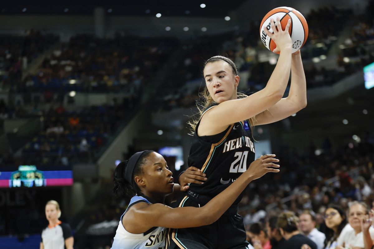 Jul 13, 2024; Chicago, Illinois, USA; New York Liberty guard Sabrina Ionescu (20) is defended by Chicago Sky guard Lindsay Allen (15) during the first half of a WNBA game at Wintrust Arena. Mandatory Credit: Kamil Krzaczynski-USA TODAY Sports