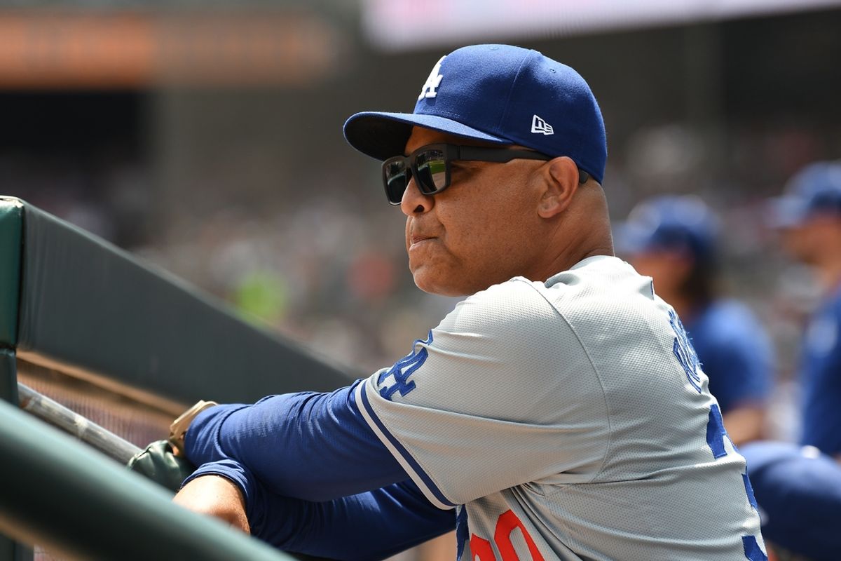 Jul 13, 2024; Detroit, Michigan, USA; Los Angeles Dodgers manager Dave Roberts (30) watches the action against the Detroit Tigers from the dugout steps in the third inning at Comerica Park. Mandatory Credit: Lon Horwedel-USA TODAY Sports