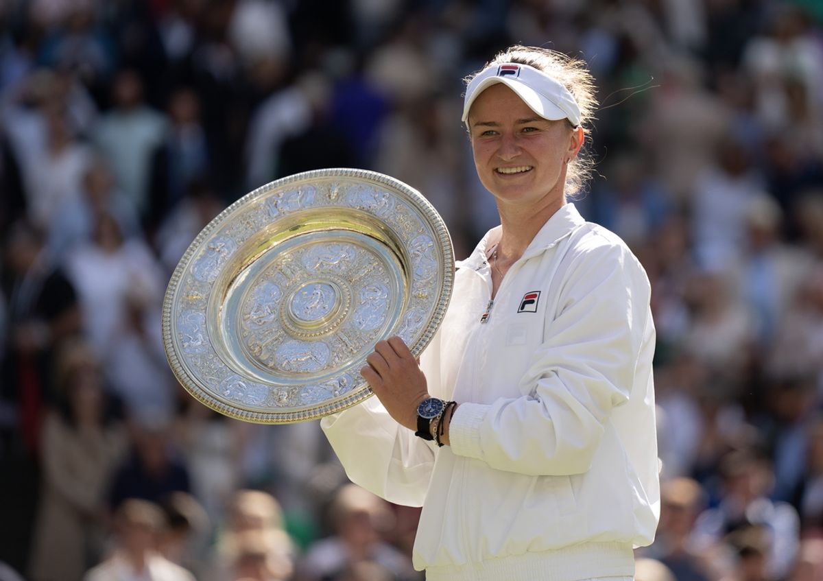 Jul 13, 2024; London, United Kingdom; Barbora Krejcikova of the Czech Republic poses with the trophy after winning the women’s singles final against Jasmine Paolini of Italy (not shown) on day 13 at All England Lawn Tennis and Croquet Club. Mandatory Credit: Susan Mullane-Imagn Images