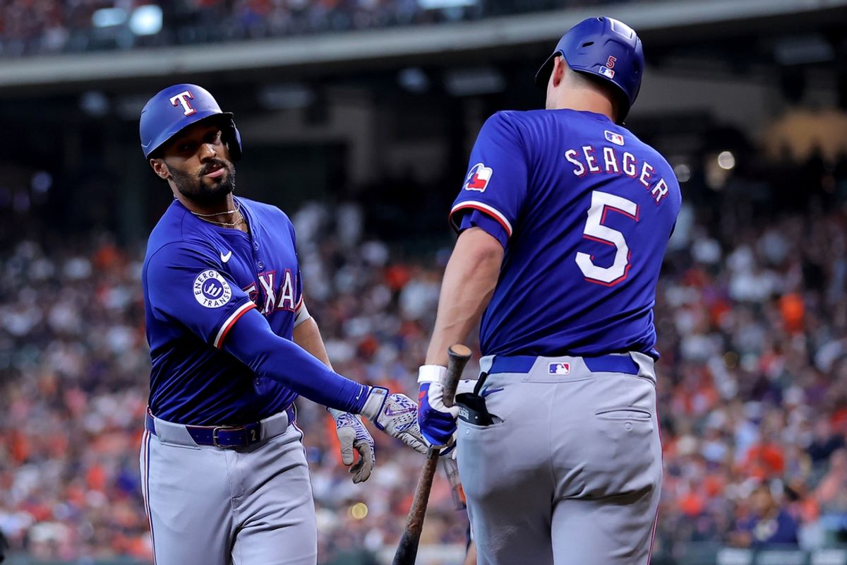 Jul 13, 2024; Houston, Texas, USA; Texas Rangers second baseman Marcus Semien (2) is congratulated by shortstop Corey Seager (5) after hitting a home run against the Houston Astros during the first inning at Minute Maid Park. Mandatory Credit: Erik Williams-Imagn Images