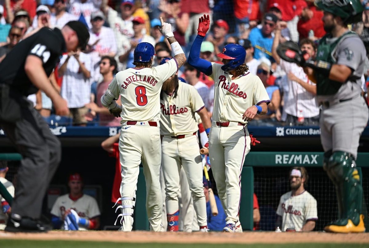 Jul 13, 2024; Philadelphia, Pennsylvania, USA; Philadelphia Phillies outfielder Nick Castellanos (8) celebrates with infielder Alec Bohm (28) after hitting a two-run home run against the Oakland Athletics in the second inning at Citizens Bank Park. Mandatory Credit: Kyle Ross-USA TODAY Sports