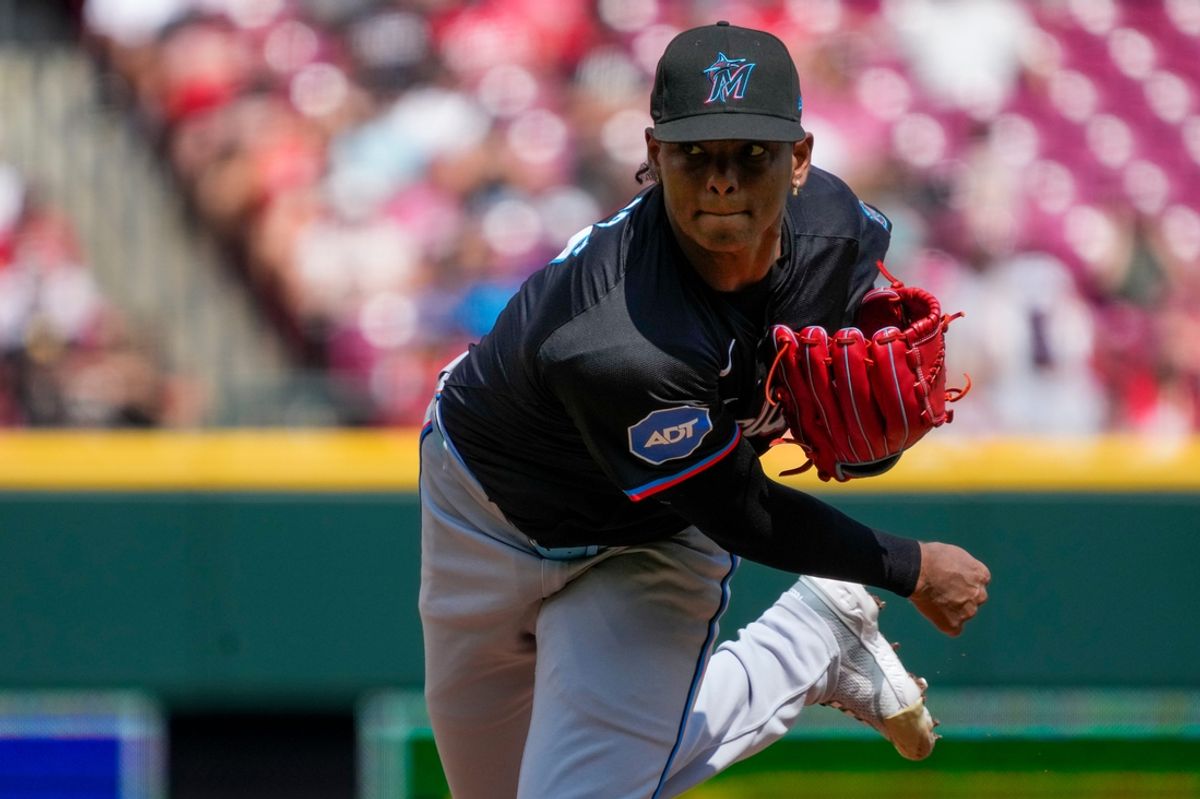 Miami Marlins starting pitcher Edward Cabrera (27) follows through one a pitch in the first inning of the MLB National League game between the Cincinnati Reds and the Miami Marlins at Great American Ball Park in downtown Cincinnati on Saturday, July 13, 2024. The Reds led 1-0 after two innings.