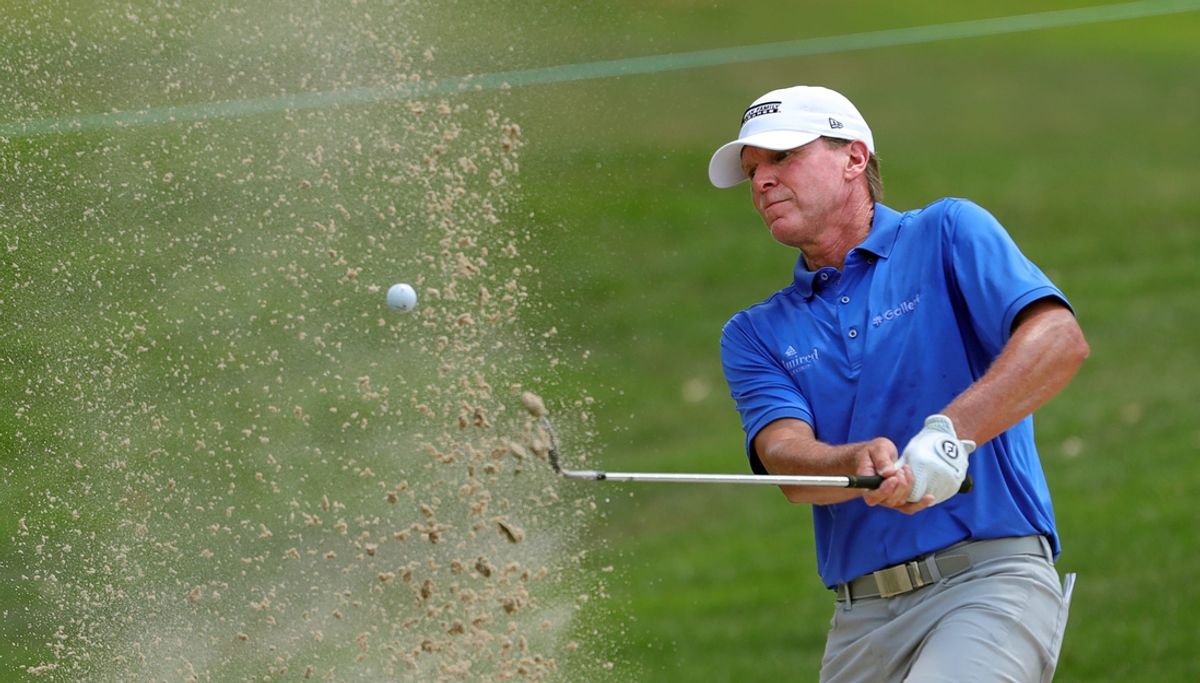 Steve Stricker plays his second shot from a bunker on the seventh hole during the third round of the Kaulig Companies Championship at Firestone Country Club, Saturday, July 13, 2024, in Akron, Ohio.