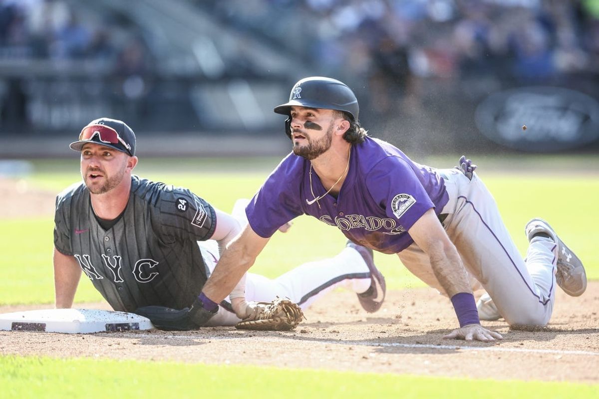 Jul 13, 2024; New York City, New York, USA;  New York Mets first baseman Pete Alonso (20) and Colorado Rockies left fielder Sam Hilliard (16) look for the call after a pick off attempts in the fifth inning at Citi Field. Mandatory Credit: Wendell Cruz-USA TODAY Sports