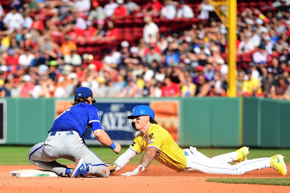 Jul 13, 2024; Boston, Massachusetts, USA; Kansas City Royals shortstop Bobby Witt Jr. (7) tags out Boston Red Sox center fielder Jarren Duran (16) trying to steal second base during the seventh inning at Fenway Park. Mandatory Credit: Bob DeChiara-USA TODAY Sports