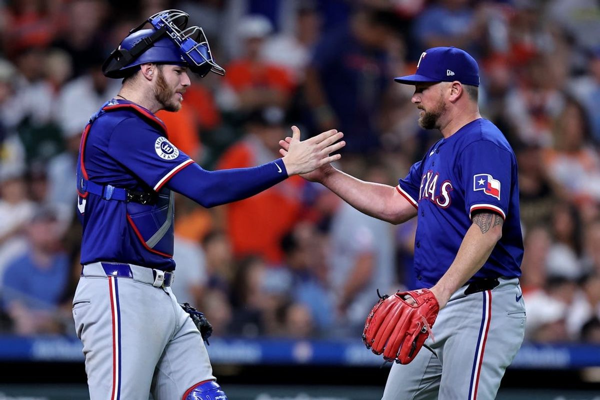 Jul 13, 2024; Houston, Texas, USA; Texas Rangers catcher Jonah Heim (28) congratulates pitcher Kirby Yates (39) after the final out against the Houston Astros during the tenth inning at Minute Maid Park. Mandatory Credit: Erik Williams-USA TODAY Sports