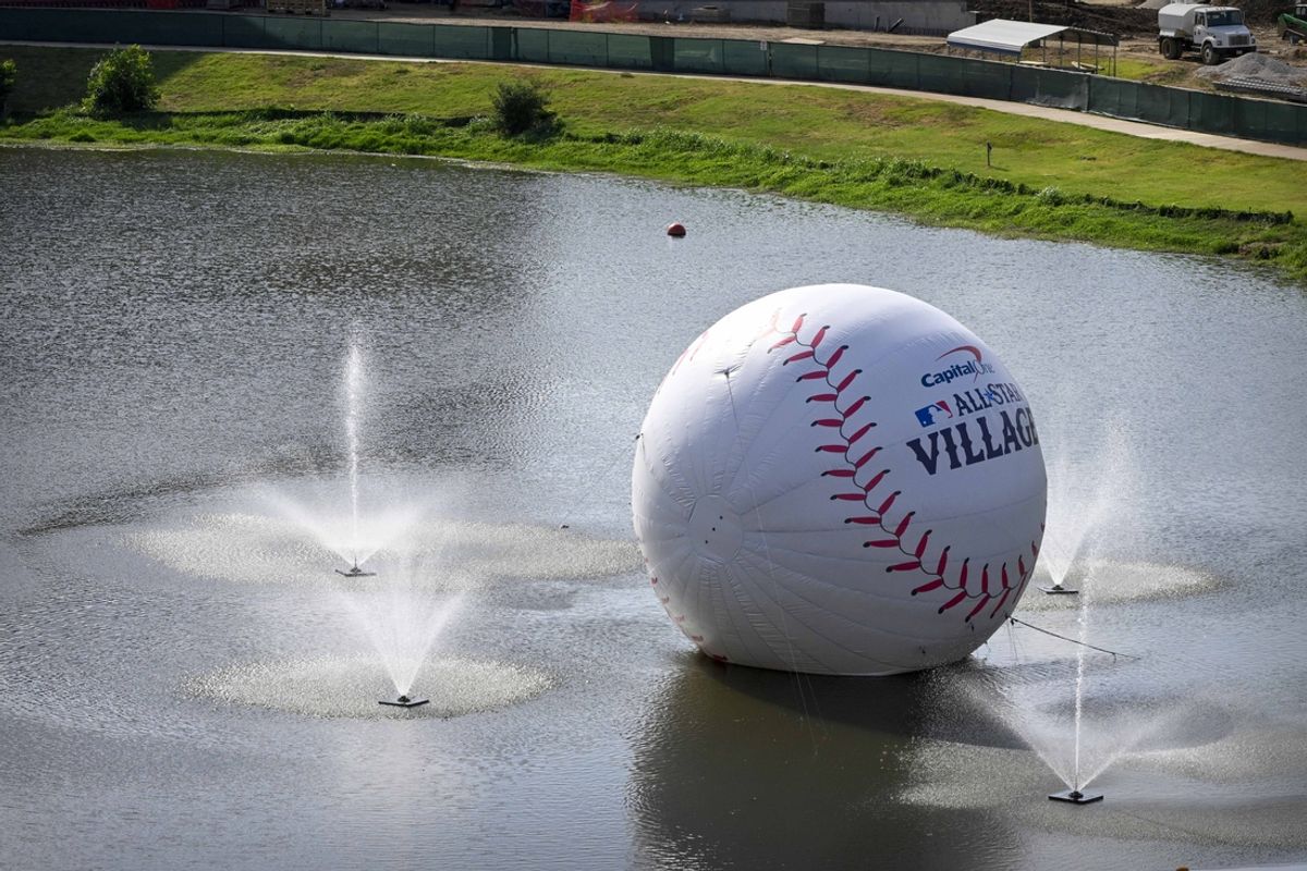 Jul 13, 2024; Arlington, TX, USA; A view of lake and giant baseball at All Star Village before the 2024 All Star Celebrity Softball Game at Globe Life Field. Mandatory Credit: Jerome Miron-Imagn Images