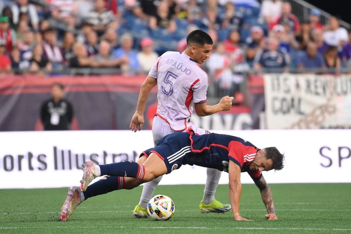 Jul 13, 2024; Foxborough, Massachusetts, USA; Orlando City SC midfielder Cesar Araujo (5) and New England Revolution forward Giacomo Vrioni (9) collide during the first half at Gillette Stadium. Mandatory Credit: Eric Canha-USA TODAY Sports