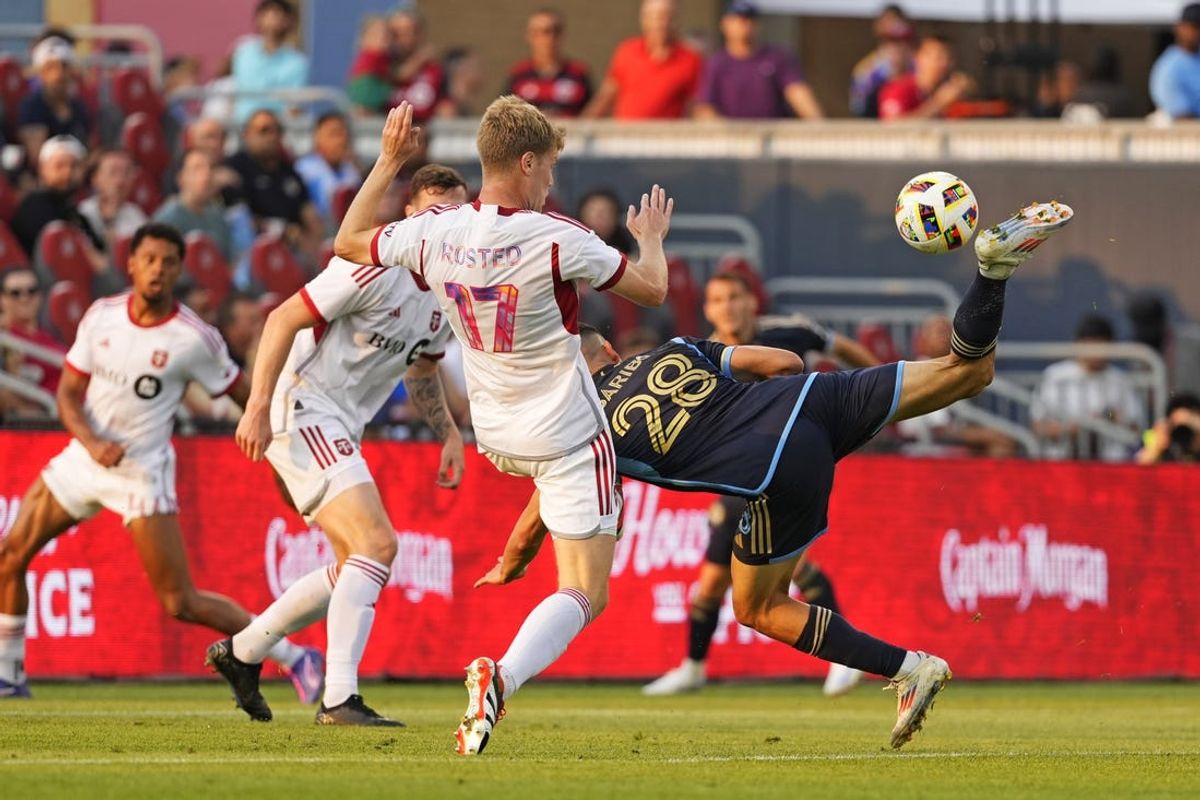 Jul 13, 2024; Toronto, Ontario, CAN; Toronto FC defender Sigurd Rosted (17) and Philadelphia Union forward Tai Baribo (28) collide while going for the ball during the first half at BMO Field. Mandatory Credit: Kevin Sousa-USA TODAY Sports