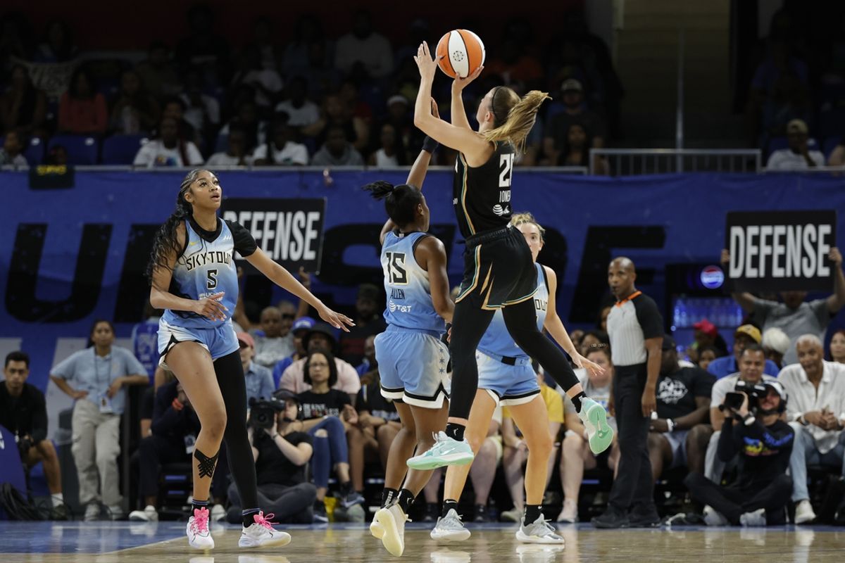 Jul 13, 2024; Chicago, Illinois, USA; New York Liberty guard Sabrina Ionescu (20) shoots against Chicago Sky guard Lindsay Allen (15) during the second half of a WNBA game at Wintrust Arena. Mandatory Credit: Kamil Krzaczynski-USA TODAY Sports