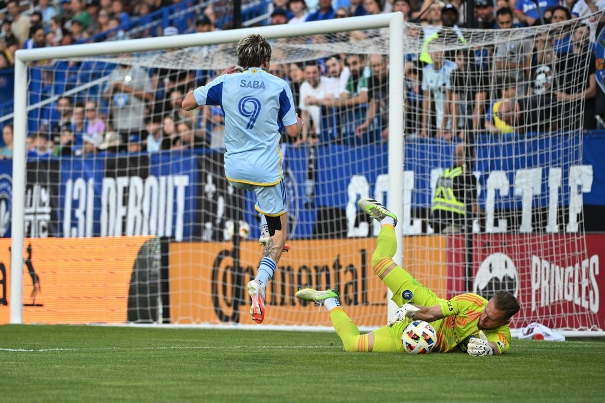 Jul 13, 2024; Montreal, Quebec, CAN; CF Montreal goalkeeper Jonathan Sirois (40) blocks Atlanta United shot from Atlanta United midfielder Saba Lobzhanidze (9) in the first half at Stade Saputo. Mandatory Credit: David Kirouac-USA TODAY Sports