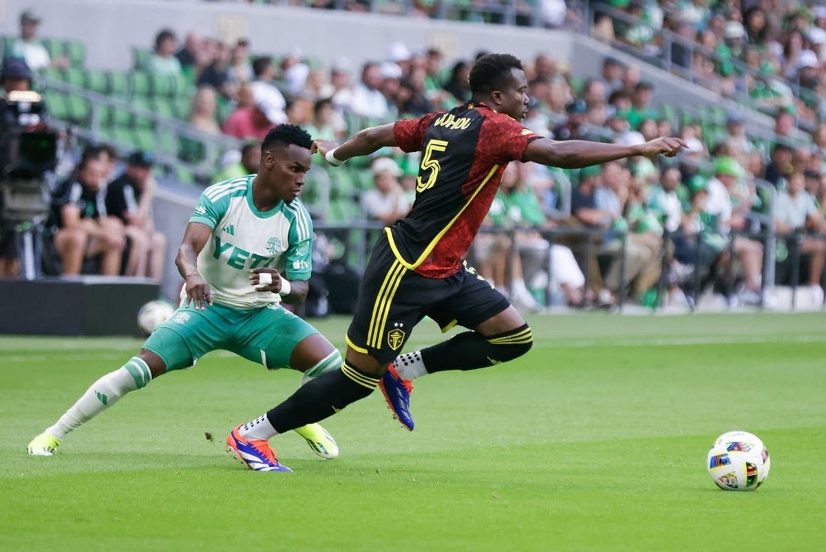 Jul 13, 2024; Austin, Texas, USA;  Austin FC forward Jáder Obrian (11) goes against Seattle Sounders FC defender Nouhou (5) at Q2 Stadium. Mandatory Credit: Erich Schlegel-USA TODAY Sports
