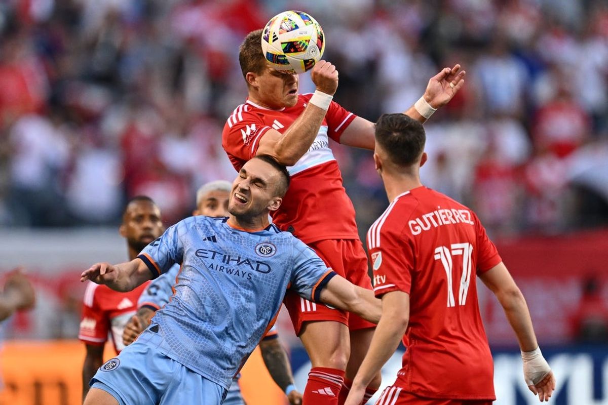 Jul 13, 2024; Chicago, Illinois, USA;  New York City FC midfielder James Sands (6) and Chicago Fire FC forward Chris Mueller (8) battle for control of the ball in the first half at Soldier Field. Mandatory Credit: Jamie Sabau-USA TODAY Sports