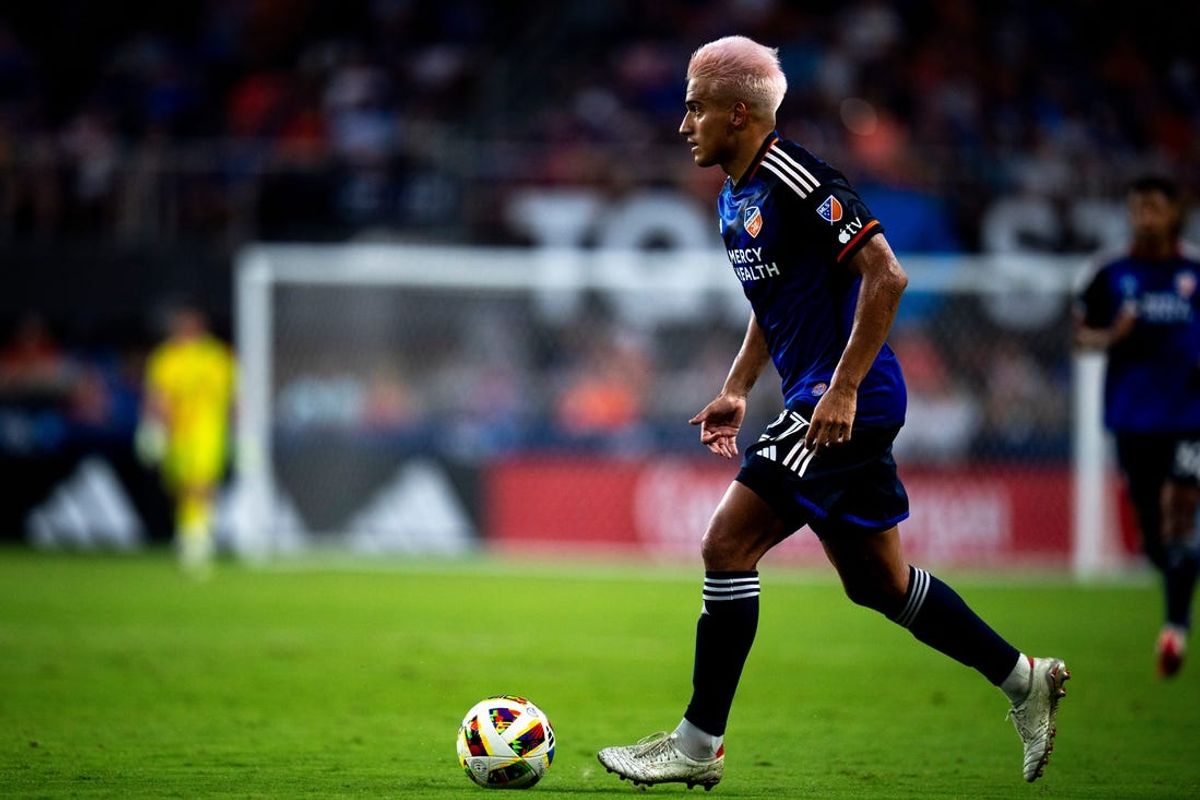 FC Cincinnati midfielder Yamil Asad (27) handles the ball in the second half of the MLS match against Charlotte FC at TQL Stadium in Cincinnati on Saturday, July 13, 2024.