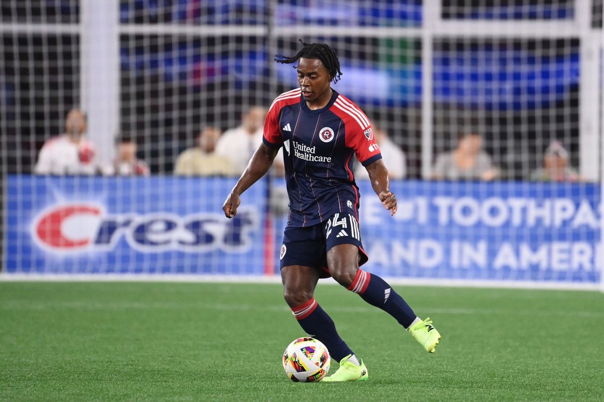 Jul 13, 2024; Foxborough, Massachusetts, USA; New England Revolution defender DeJuan Jones (24) passes the ball during the second half against the Orlando City SC at Gillette Stadium. Mandatory Credit: Eric Canha-USA TODAY Sports