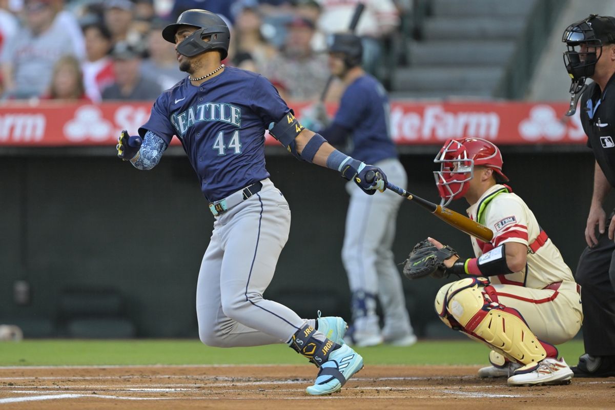 Jul 13, 2024; Anaheim, California, USA;  J.P. Julio Rodriguez #44 of the Seattle Mariners hits a RBI single in the first inning against the Los Angeles Angels at Angel Stadium. Mandatory Credit: Jayne Kamin-Oncea-USA TODAY Sports