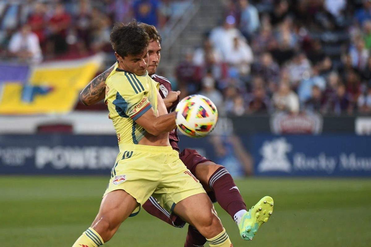 Jul 13, 2024; Commerce City, Colorado, USA; New York Red Bulls forward Dante Vanzeir (13) battles Colorado Rapids defender Andreas Maxsø (5) in the first half at Dick's Sporting Goods Park. Mandatory Credit: Christopher Hanewinckel-USA TODAY Sports