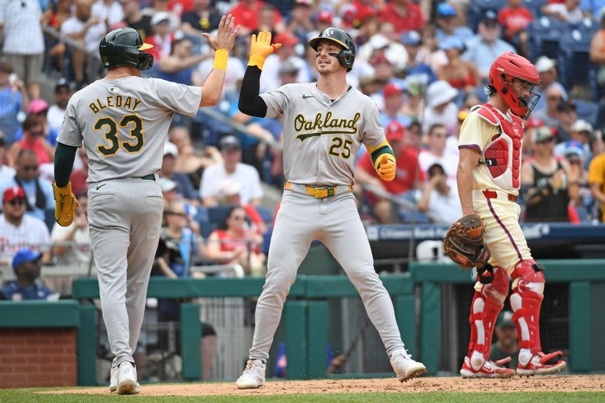 Jul 14, 2024; Philadelphia, Pennsylvania, USA; Oakland Athletics outfielder Brent Rooker (25) celebrates with  outfielder JJ Bleday (33) after hitting a two-run home run against Philadelphia Phillies during the sixth inning at Citizens Bank Park. Mandatory Credit: Eric Hartline-USA TODAY Sports