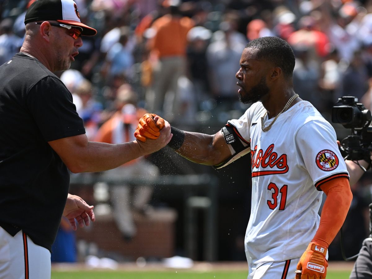Jul 14, 2024; Baltimore, Maryland, USA;  Baltimore Orioles outfielder Cedric Mullins (31) celebrates with manager Brandon Hyde (18) after a win against the New York Yankees at Oriole Park at Camden Yards. Mandatory Credit: James A. Pittman-USA TODAY Sports