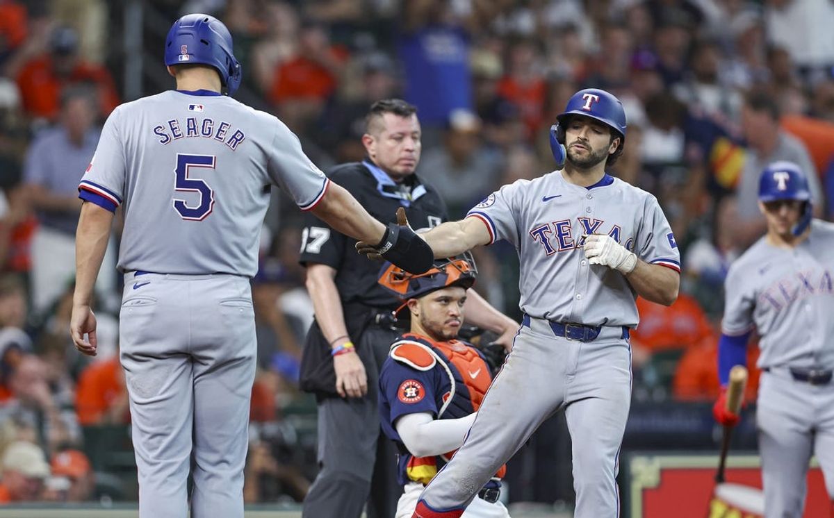 Jul 14, 2024; Houston, Texas, USA; Texas Rangers third baseman Josh Smith (8) celebrates with shortstop Corey Seager (5) after hitting a two-run home run during the eighth inning against the Houston Astros at Minute Maid Park. Mandatory Credit: Troy Taormina-USA TODAY Sports