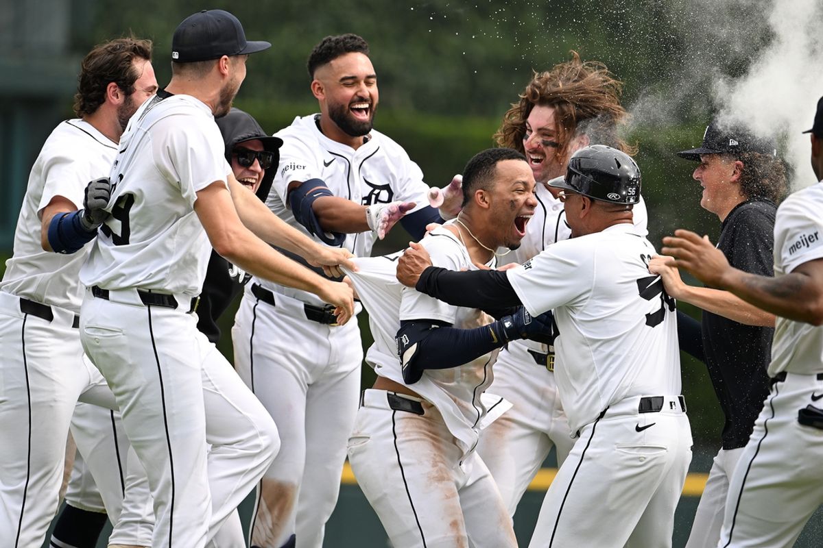 Jul 14, 2024; Detroit, Michigan, USA;  Detroit Tigers right fielder Wenceel Pérez (46) celebrates with teammates after his bunt scored the game-winning run against the Los Angeles Dodgers in the ninth inning at Comerica Park. Mandatory Credit: Lon Horwedel-USA TODAY Sports