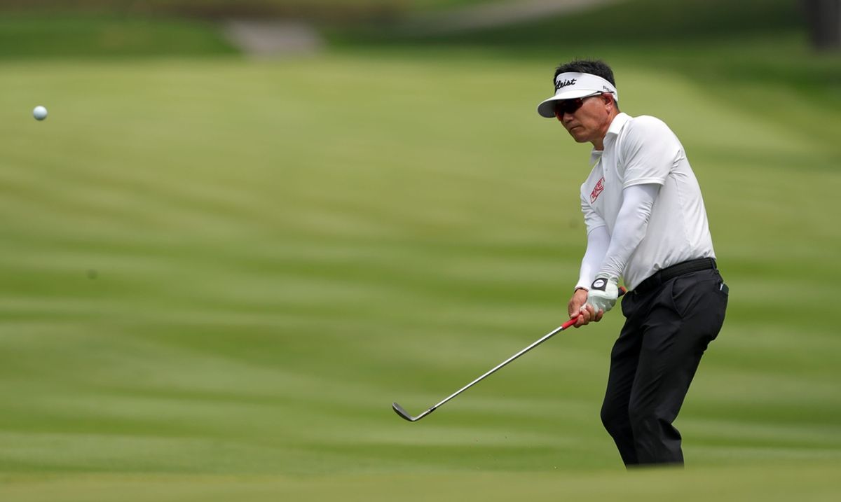 Y.E. Yang watches his shot onto the green on the fourth hole during the final round of the Kaulig Companies Championship golf tournament at Firestone Country Club, Sunday, July 14, 2024, in Akron, Ohio.