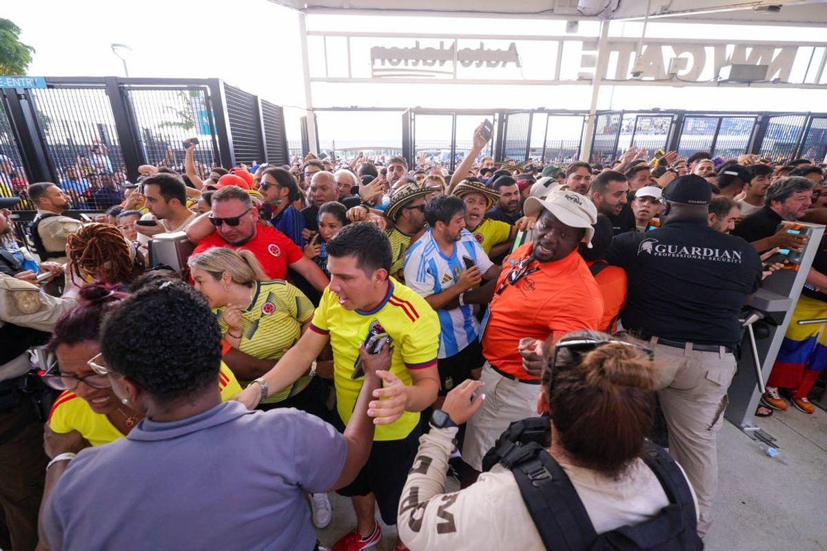Jul 14, 2024; Miami, FL, USA;  fans rush the gates before the Copa America Final match between Argentina and Colombia at Hard Rock Stadium. Mandatory Credit: Nathan Ray Seebeck-USA TODAY Sports