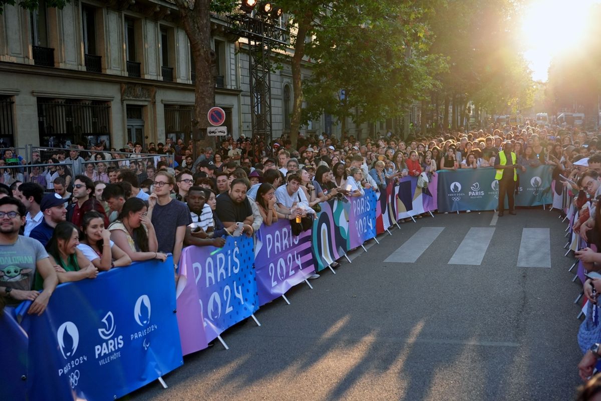 A general view of crowds waiting for the Olympic torch during festivities at L'hotel de Ville on Bastille Day ahead of the 2024 Paris Olympics. Mandatory Credit: Jon Durr-USA TODAY Sports