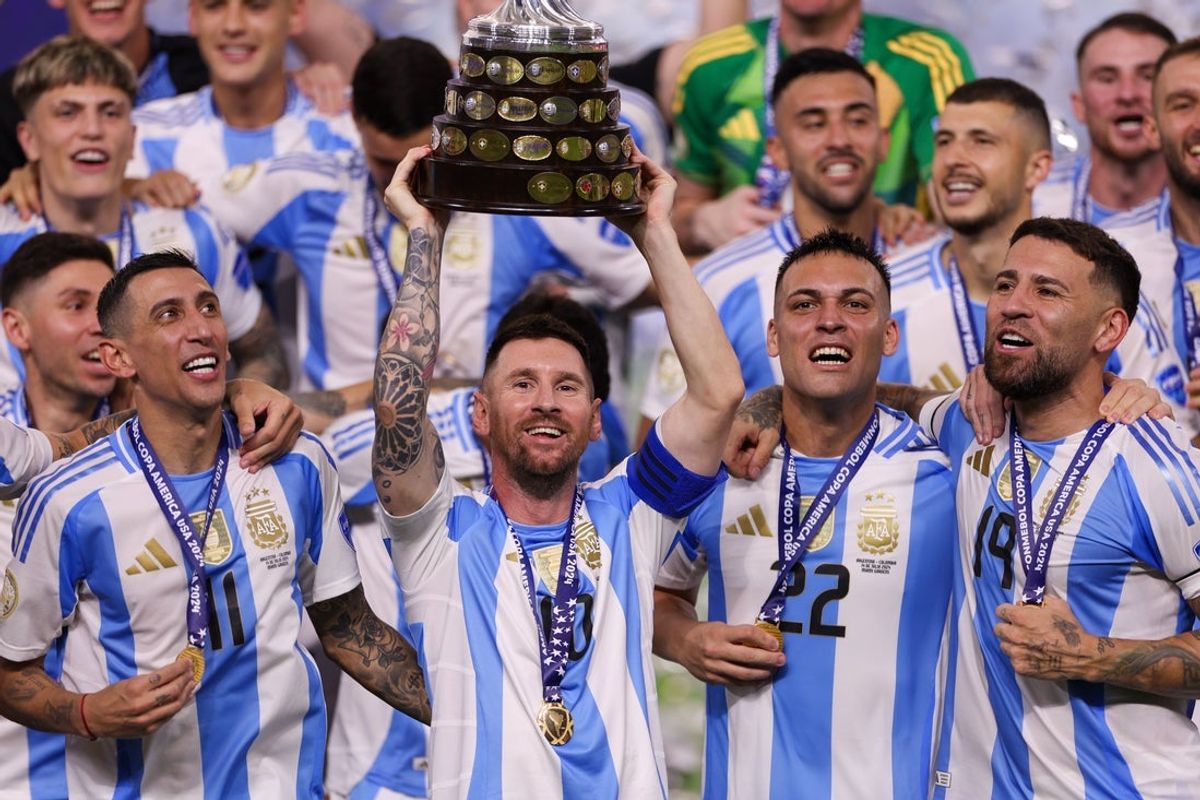 Jul 14, 2024; Miami, FL, USA;  Argentina forward Lionel Messi (10) midfielder Angel Di Maria (11) forward Lautaro Martínez (22) and defender Nicolas Otamendi (19) celebrate after winning the Copa America Final against Colombia at Hard Rock Stadium. Mandatory Credit: Nathan Ray Seebeck-Imagn Images
