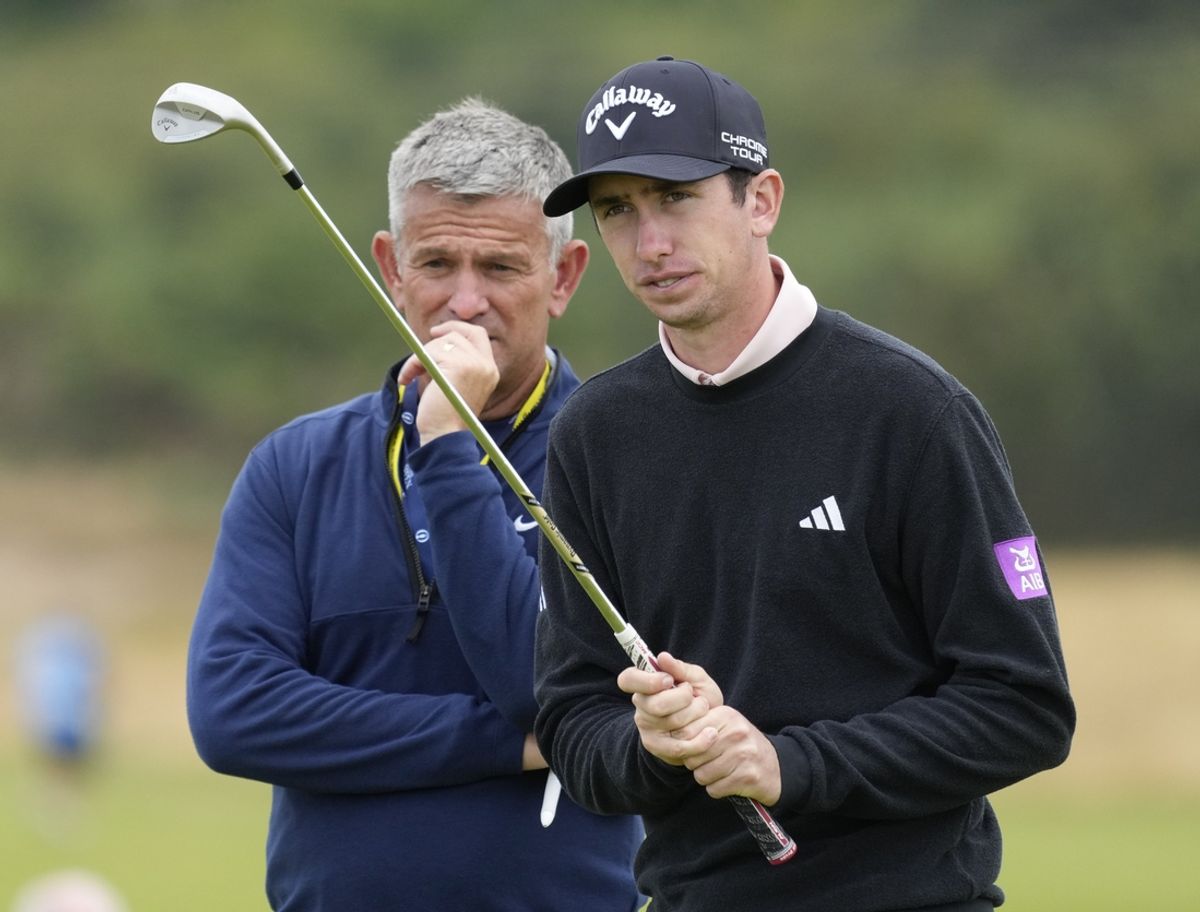 Jul 17, 2024; Ayrshire, SCT; Tom McKibbin, right, a Northern Irish professional golfer who grew up playing golf at Holywood Golf Club, the same home club as Rory McIlroy, playing on the 12th green during practice rounds at the Open Championship golf tournament at Royal Troon. Mandatory Credit: Jack Gruber-Imagn Images