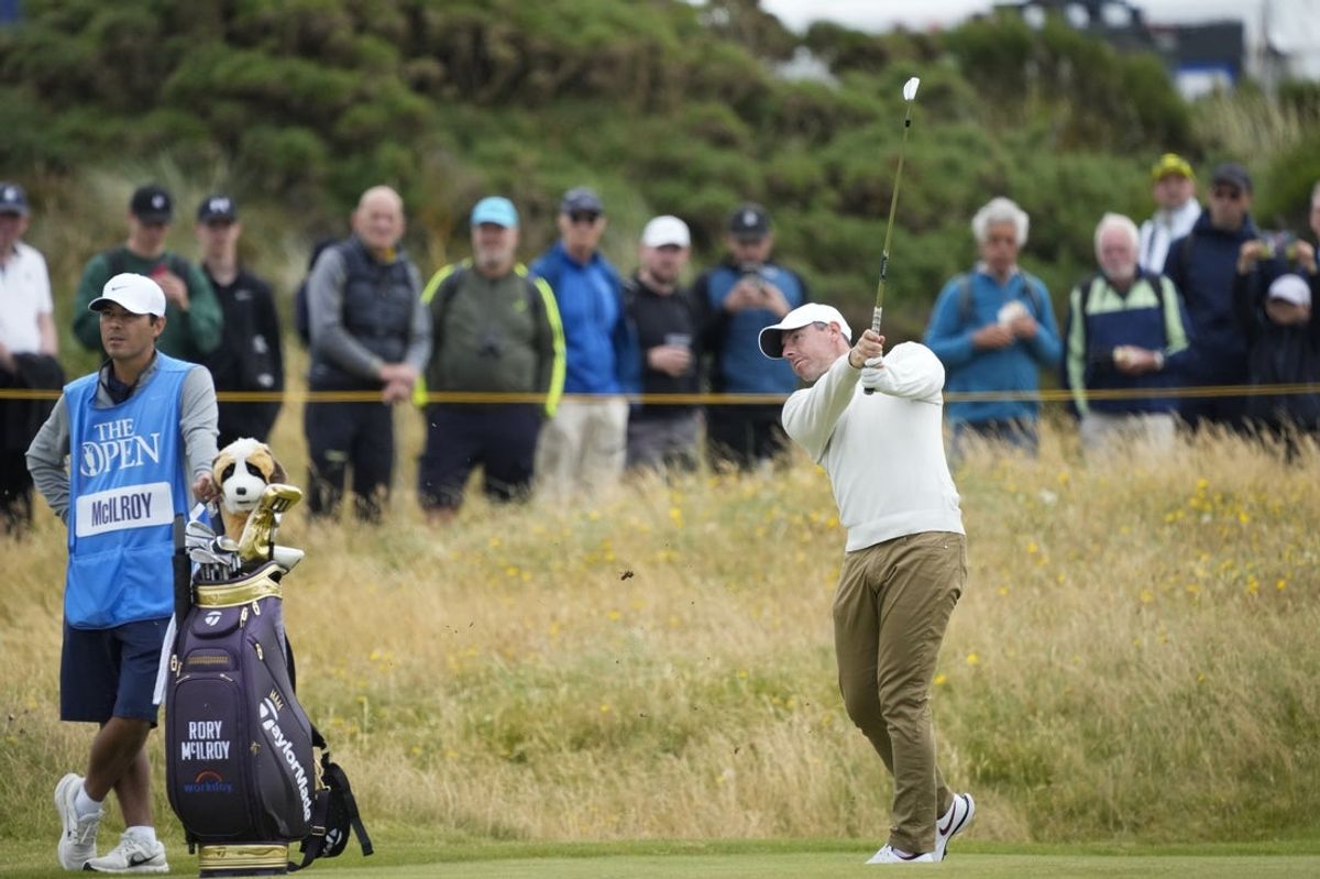 Rory McIlroy, right, playing on the 13th fairway during practice rounds at the 2024 Open Championship golf tournament at Royal Troon. Mandatory Credit: Jack Gruber-Imagn Images