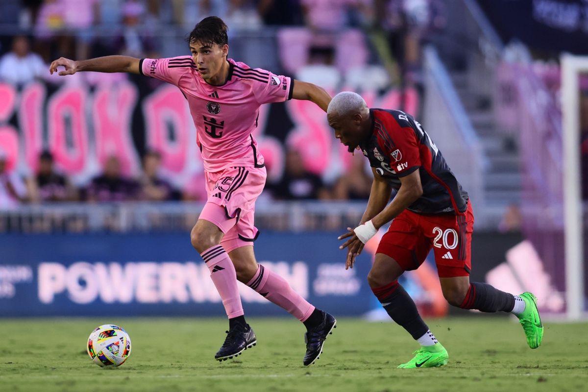 Jul 17, 2024; Fort Lauderdale, Florida, USA; Inter Miami CF midfielder Federico Redondo (55) kicks the ball past Toronto FC midfielder Deybi Flores (20) during the first half at Chase Stadium. Mandatory Credit: Sam Navarro-USA TODAY Sports