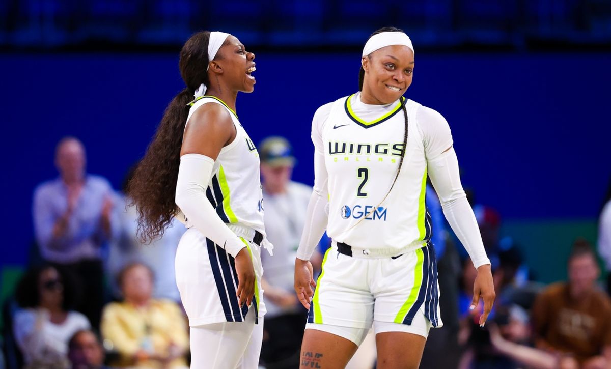 Jul 17, 2024; Arlington, Texas, USA;  Dallas Wings guard Arike Ogunbowale (24) celebrates with Dallas Wings guard Odyssey Sims (2) after the game against the Indiana Fever at College Park Center. Mandatory Credit: Kevin Jairaj-USA TODAY Sports