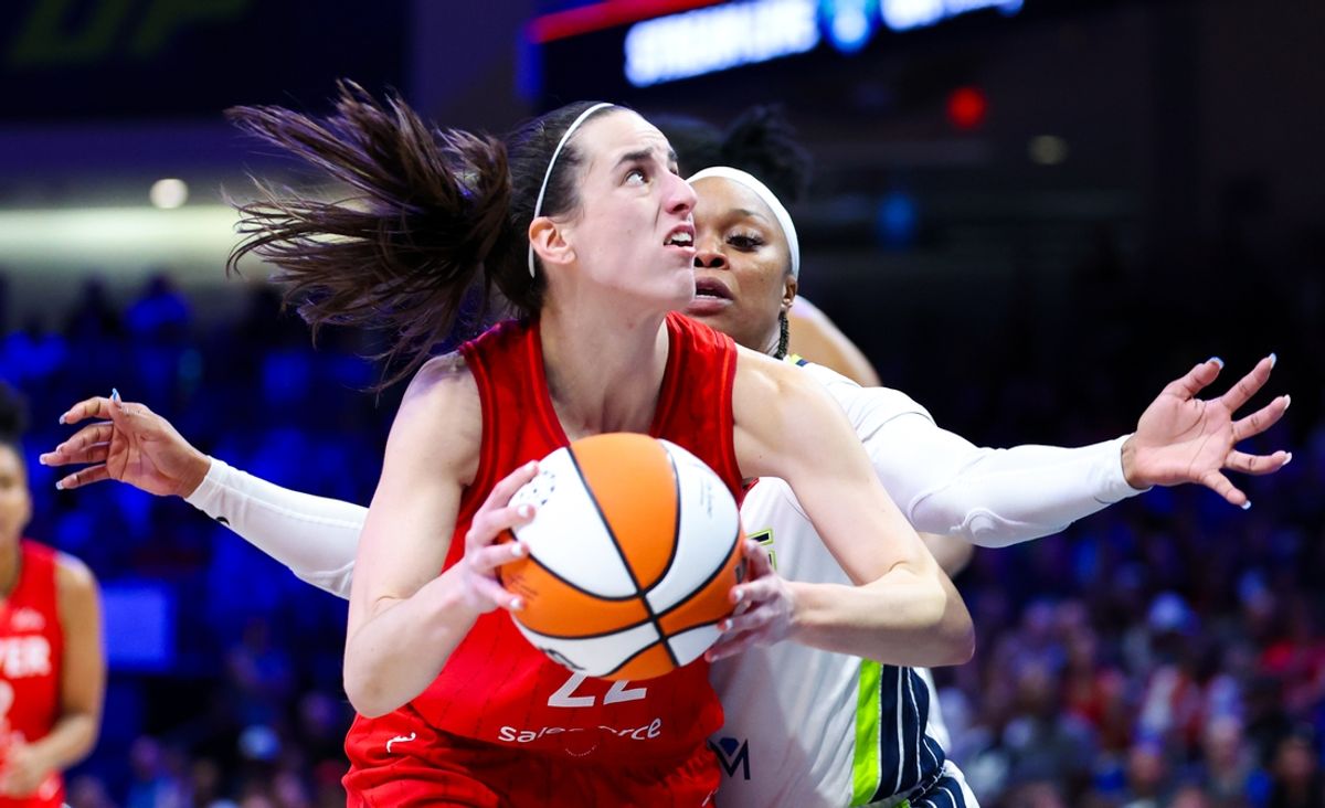 Jul 17, 2024; Arlington, Texas, USA; Indiana Fever guard Caitlin Clark (22) looks to shoot as Dallas Wings guard Odyssey Sims (2) defends  during the second half at College Park Center. Mandatory Credit: Kevin Jairaj-USA TODAY Sports