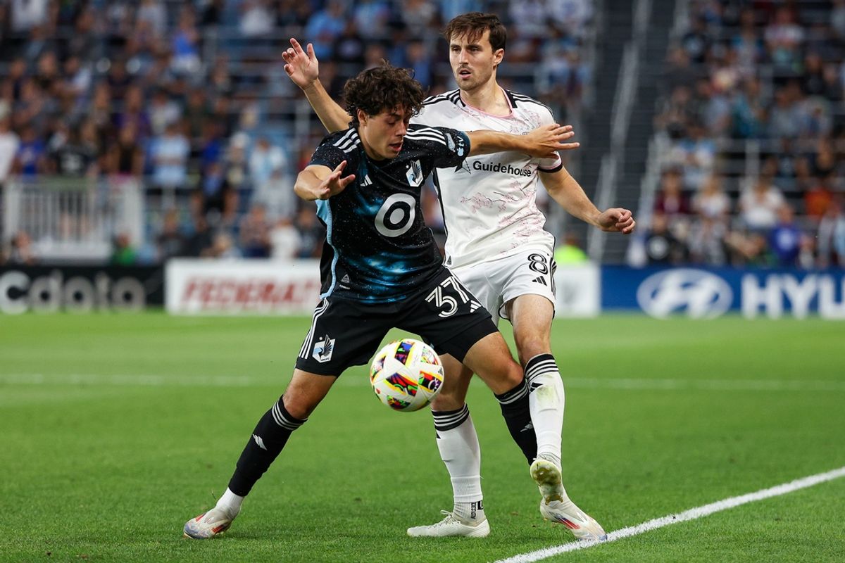 Jul 17, 2024; Saint Paul, Minnesota, USA; Minnesota United midfielder Caden Clark (37) and D.C. United midfielder Jared Stroud (8) compete for the ball during the second half at Allianz Field. Mandatory Credit: Matt Krohn-USA TODAY Sports