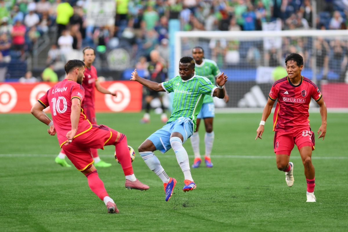 Jul 17, 2024; Seattle, Washington, USA; St. Louis CITY SC midfielder Eduard Loewen (10) steals the ball from Seattle Sounders FC defender Nouhou (5) during the first half at Lumen Field. Mandatory Credit: Steven Bisig-USA TODAY Sports