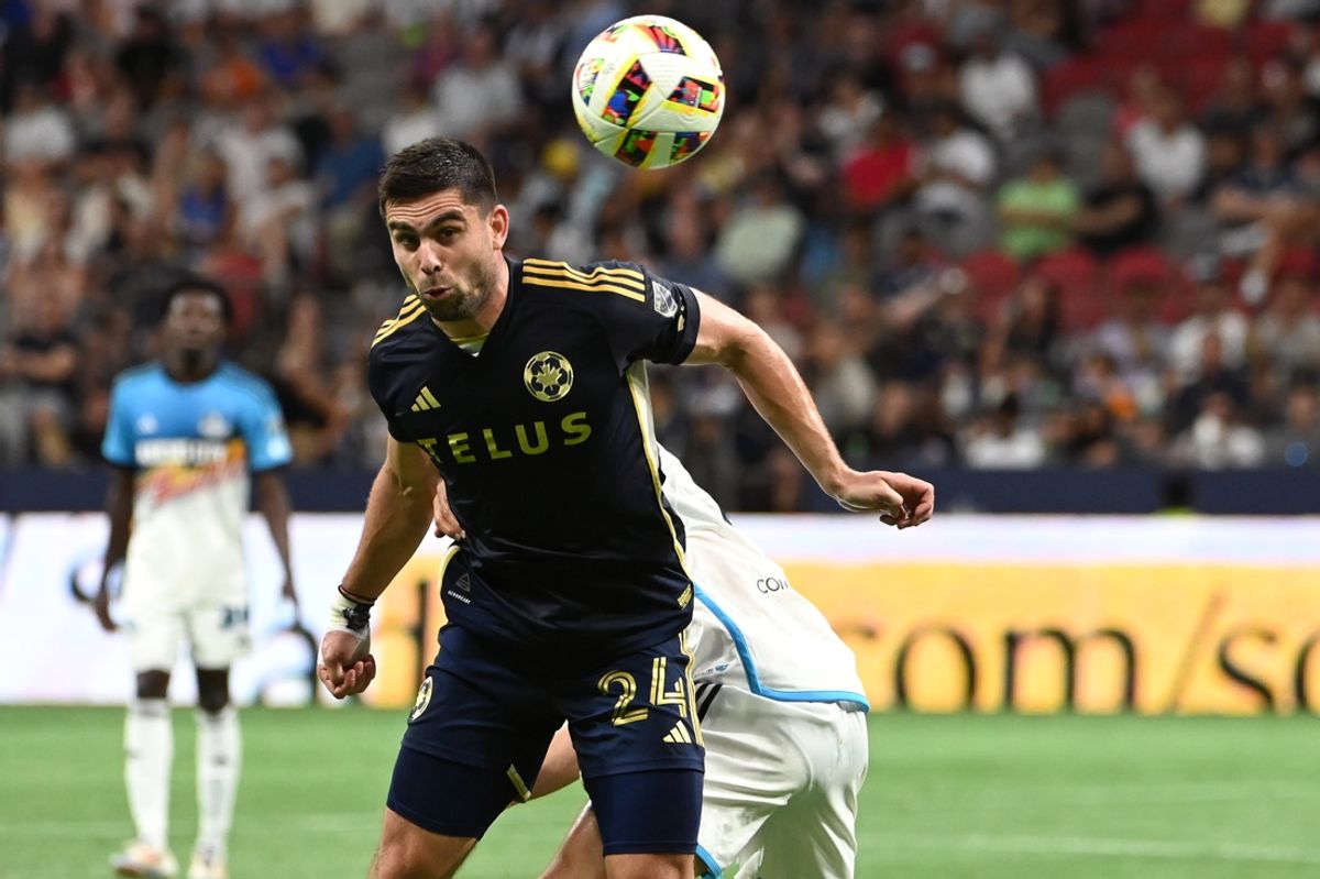 Jul 17, 2024; Vancouver, British Columbia, CAN; Vancouver Whitecaps FC forward Brian White (24) heads the ball during the second half against Sporting Kansas City at BC Place. Mandatory Credit: Simon Fearn-USA TODAY Sports