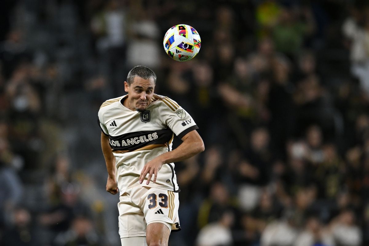 Jul 17, 2024; Los Angeles, California, USA; LAFC defender Aaron Long (33) heads the ball against Real Salt Lake during the second half at BMO Stadium. Mandatory Credit: Jonathan Hui-USA TODAY Sports