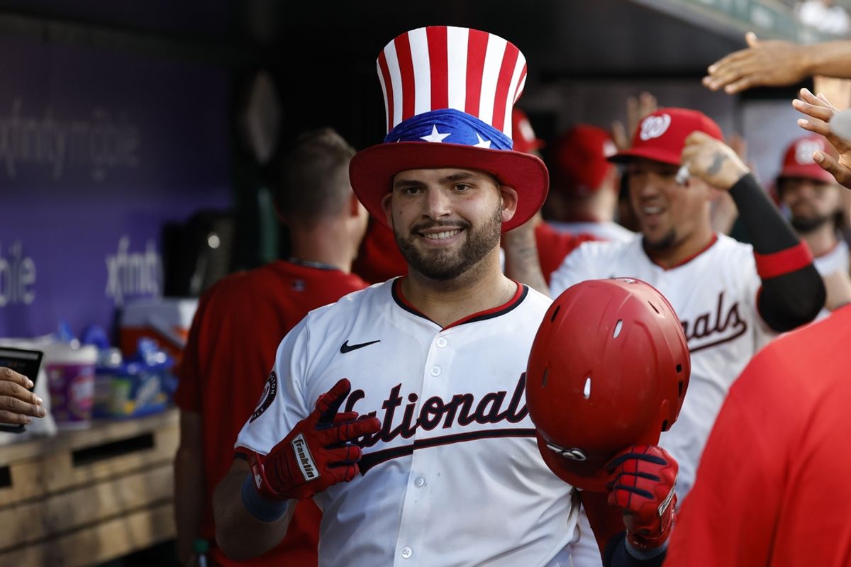 Jul 19, 2024; Washington, District of Columbia, USA; Washington Nationals first baseman Juan Yepez (18) celebrates in the dugout after hitting a three run home run against the Cincinnati Reds during the fifth inning at Nationals Park. Mandatory Credit: Geoff Burke-USA TODAY Sports