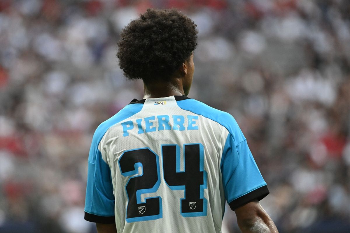 Jul 17, 2024; Vancouver, British Columbia, CAN;  Sporting Kansas City defender Kayden Pierre (24) watches play during the first half against Vancouver Whitecaps FC at BC Place. Mandatory Credit: Anne-Marie Sorvin-Imagn Images
