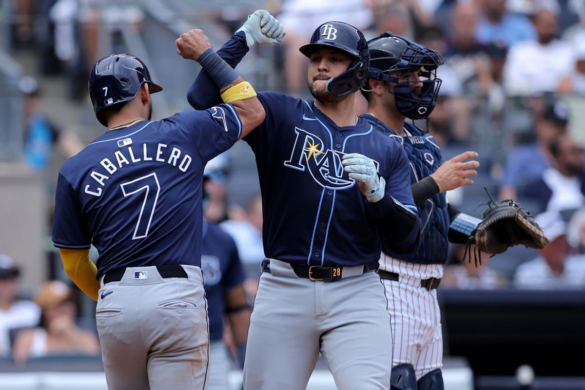 Jul 20, 2024; Bronx, New York, USA; Tampa Bay Rays catcher Alex Jackson (28) celebrates his three run home run against the New York Yankees with second baseman Jose Caballero (7) during the fourth inning at Yankee Stadium. Mandatory Credit: Brad Penner-USA TODAY Sports