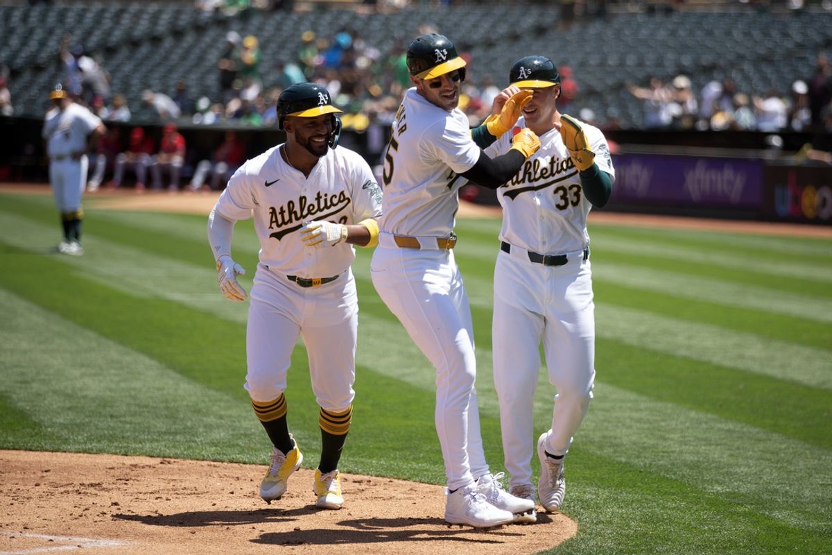 Jul 20, 2024; Oakland, California, USA; Oakland Athletics designated hitter Brent Rooker (25) celebrates his three-run home run with teammates Miguel Andujar (22)vand JJ Bleday (33) during the first inning against the Los Angeles Angels at Oakland-Alameda County Coliseum. Mandatory Credit: D. Ross Cameron-USA TODAY Sports