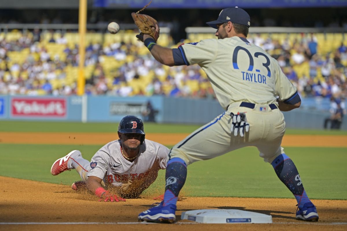 Jul 20, 2024; Los Angeles, California, USA;  Los Angeles Dodgers left fielder Chris Taylor (3) takes the throw as Boston Red Sox center fielder Ceddanne Rafaela (43) is tagged out at third on a throw from Teoscar Hernandez (37) in the fourth inning at Dodger Stadium. Mandatory Credit: Jayne Kamin-Oncea-USA TODAY Sports