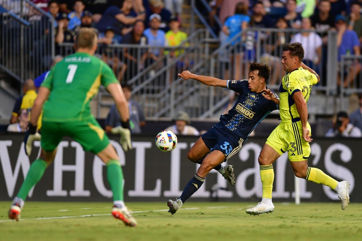 Jul 20, 2024; Philadelphia, Pennsylvania, USA; Philadelphia Union midfielder Quinn Sullivan (33) plays the ball defended by Nashville SC defender Taylor Washington (23) in the first half at Subaru Park. Mandatory Credit: Caean Couto-USA TODAY Sports